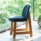 Sophisticated Moroso Pheaby chair with textured gray fabric upholstery and painted ash structure showcasing a light tone