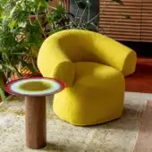 Harmonious Moroso Ruff lounge chair in bright yellow textured textile with architecturally interactive rounded form