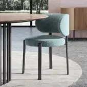 Sophisticated Turri Roma chair with a rounded light blue textile backrest and dark gray matte metal legs