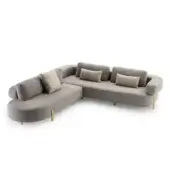 Roma sectional sofa, gray fabric, L-shape with brass legs and three matching accent pillows in a studio setting.