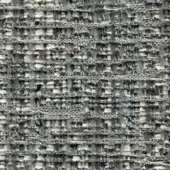 Gray and off-white tweed fabric texture with irregular woven threads, displaying a nubby surface and subtle variegated pattern; “elite 297 21” label.