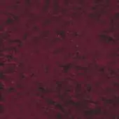 Burgundy fabric swatch displaying a dense, mottled texture with tonal variations ranging from dark brown to vibrant red hues, even diffused lighting.