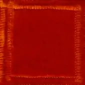 Red fabric square with textured surface and fringed border, displaying a vertical grain and subtle sheen against a solid red backdrop.