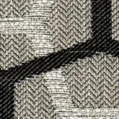 Herringbone woven textile with diagonal black bands over light gray and off-white checkerboard, dense fabric texture, grayscale palette.