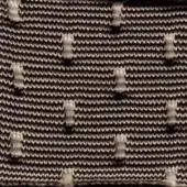 Ribbed fabric with cream swan motifs, dark brown and cream tones, densely knit texture, irregular pattern, handcrafted aesthetic.