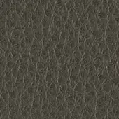 Dark gray textured material with interwoven linear pattern, matte finish, resembling synthetic leather; handwritten notation visible.