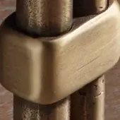 Cast brass hardware with bronzed patina, octagonal connector featuring cylindrical rods and textured surface, aged metal finish.