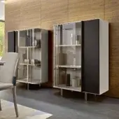 Distinguished Turri Zero cupboard with architectural design, glass door showcasing wooden or marble shelves edged in metal, and contrasting dark finish