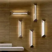 Superior Turri Zero wall lamp crafted in dark metal with clear glass creating a geometric form and warm white light