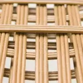 Woven artificial leather texture, light brown grid pattern, square design with subtle sheen, neutral off-white background, even diffused lighting.