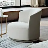 Elegant Turri Blues lounge chair with two-tone upholstery in off-white textile and darker gray leather, exhibiting a smooth matte finish