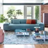 Elegant Moroso Loveland sofa in muted blue textured textile with ash wood varnished feet