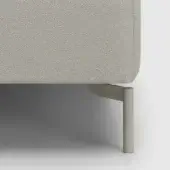 Sofa leg detail, light gray herringbone fabric upholstery, brushed metal cylindrical legs, angled bracket support, white background.