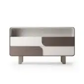 Turri Soul dresser, walnut and gray, rounded rectangular form with brass legs and recessed drawer pulls against a white backdrop.