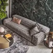 Distinguished Turri Azul sofa crafted in medium gray velvet with a macro weave and fringed dark gray cushions