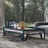 Exceptional Turri Azul coffee table with a deep teal textile base and reflective glass top crafted in Italy