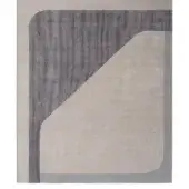 Rugiano Zenit rug, beige geometric design with dark gray stripe, curved gray border, plush velvety texture, studio product shot.