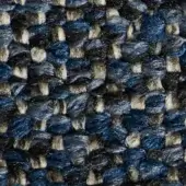 Woven fabric texture, deep blue with gray and off-white threads, irregular speckled pattern, tight nubby weave, durable tactile quality.