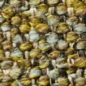 Gold, brown, and gray-blue tweed fabric texture with a heathered, nubby weave and off-white warp threads for a rustic appearance.