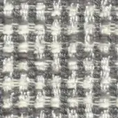 Woven tweed fabric, off-white and charcoal gray, dense irregular weave with nubby texture; “nicotrend 668 013” pattern sample.