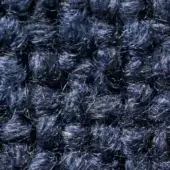 Blue-gray looped pile fabric texture with heathered effect, showing tight, irregular synthetic fiber loops and a nubby, felt-like surface.