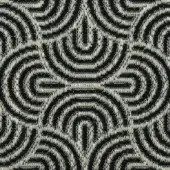 Geometric textile pattern in black and cream tones features concentric teardrops and elongated diamonds, woven with a textured, slightly raised surface.