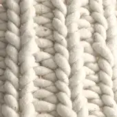 Chunky knit fabric, creamy white, grid weave with twisted yarn forming vertical and horizontal columns, handmade texture.