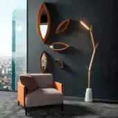 Captivating Horm Aira floor lamp with organic silhouette crafted in gold painted brass and premium marble base