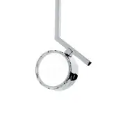 Chrome examination light with vertical arm, circular base, pivoting support, and ridged reflective lens casing, minimalist design.