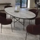 Distinguished Horm Alexander table with oval marble tabletop and dark-toned metal trestle base crafted in Italy