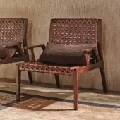 Distinguished Turri Net Lounge Chair with woven saddle leather and walnut wood built with a dark brown stain