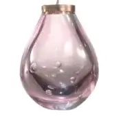 Pink crystal pendant light, brass fitting, teardrop shade with translucent pink glass and air bubbles, handcrafted aesthetic.