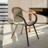 Distinguished Horm Ginevra armchair crafted with solid walnut wood and light beige premium textile upholstery