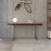 Distinguished Horm Imperio desk with dark red tabletop, gold-colored metal legs and central drawer crafted in Italy