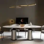 Distinguished Horm Marien table with light gray and white marble tabletop edged in black and brushed silver metal base