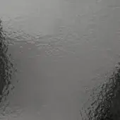 Hammered smoky glass texture displays mottled gray and charcoal tones, with a rippled, reflective surface and darkened edges creating a vignette effect.
