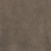 Distressed leather texture sample in muted rust color, displaying fine wrinkles, creases, and pores with a matte finish.
