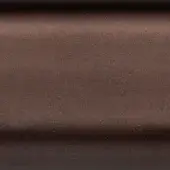 Bronze metal surface with a brushed texture and horizontal seam, displaying a matte, brownish tone and diffused lighting.