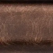 Brushed metal texture with brownish-bronze tone, exhibiting swirling scratches and a curved surface; etched text reads "borzalino > metal > delabre v3 metal".