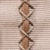 Beige canvas fabric with dark brown crisscross stitching detail, displaying a ribbed texture and hand-applied, slightly irregular pattern.