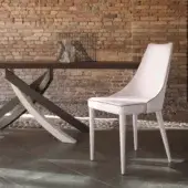 Elegant Bontempi Clara chair crafted in Italy with smooth light cream upholstery and slender matching legs