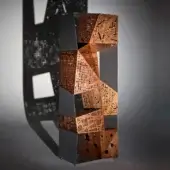 Exceptional Horm Riddled Totem storage unit with an aluminum frame and five origami-folded wooden compartments exhibiting a laser-cut geometric design