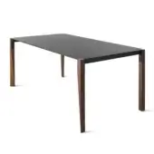 Distinctive Horm Tango extendable table with a dark gray Fenix tabletop and dark metal frame built with dancing wooden legs in a dark brown finish