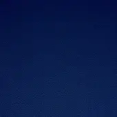 Platinum Flukso fabric sample, deep blue, fine-grained texture with circular indentations, matte finish, durable woven material.