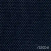 Vescom Rolla Blu Notte textile, midnight blue fabric with repeating raised circular dot pattern and subtle sheen.