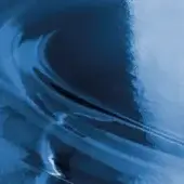 Abstract blue texture with swirling marbled patterns, glossy finish, and tonal variations; miniforms glass sample in blu blue.