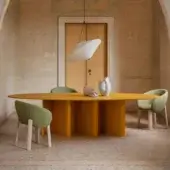 Elegant Miniforms Nami table crafted with bent wood base and oval tabletop lacquered in matte yellow