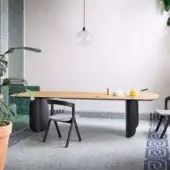 Exceptional Miniforms Barry table with a natural wood tabletop and black curved pedestal legs crafted in a matte finish