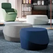 Sophisticated Casamania Giro ottoman with cylindrical form upholstered in premium fabric transitioning from deep blue to almost black