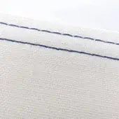 White fabric texture with diagonal cobalt blue stitching, displaying a tight weave and subtle horizontal-vertical thread pattern under diffused lighting.